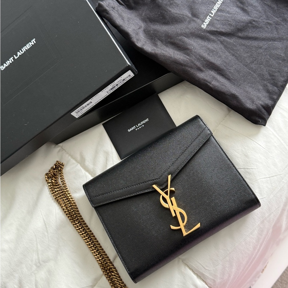 Saint Laurent Black and Gold Leather Clutch with YSL Emblem